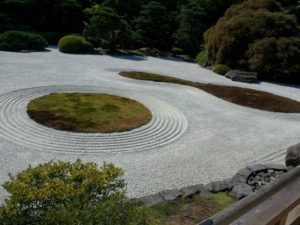 Meditative stones represent ripples of soothing water.