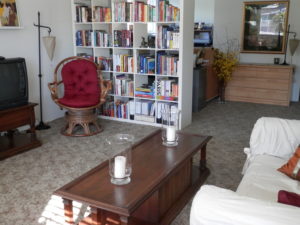 The Home Office tucked behind the bookcase is functional and practical. ~After feng shui clean up.